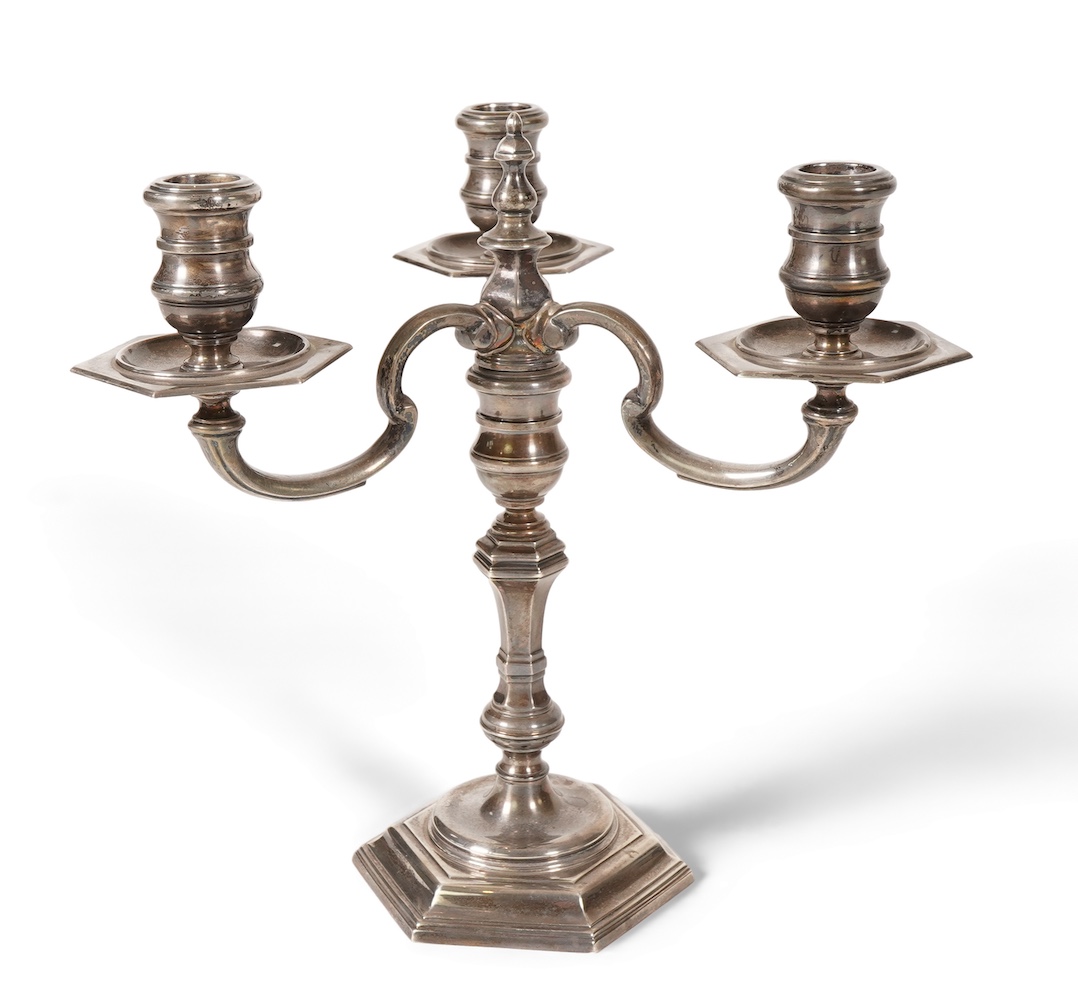 An Elizabeth II silver three branch, three light candelabrum, by William Comyns & Sons Ltd